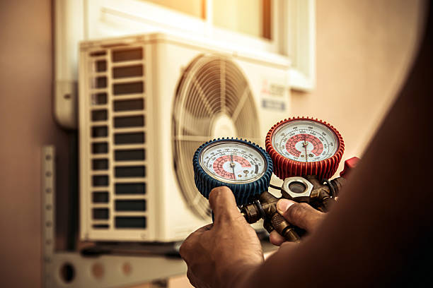 Professional Heat Pump Repair technician working in Malakoff, TX